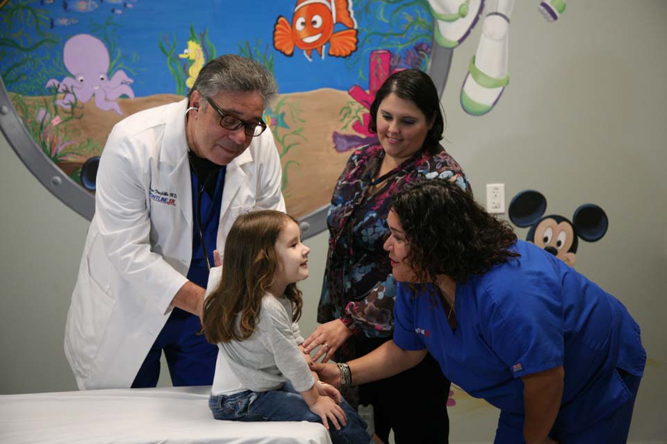 little girl with doctor parent and nurse