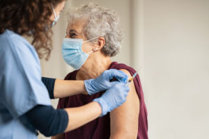 Senior getting covid vaccine.